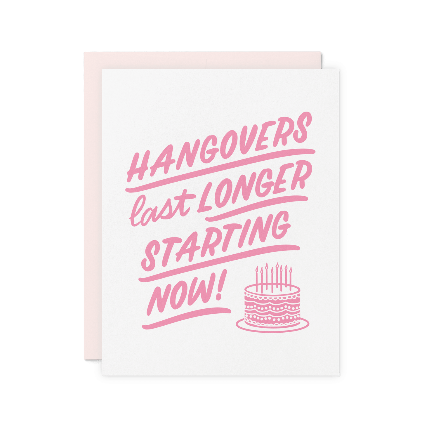 Funny birthday card with 'Hangovers Last Longer Starting Now!' in pink hand lettering, featuring a birthday cake illustration, letterpress printed on thick cotton paper.