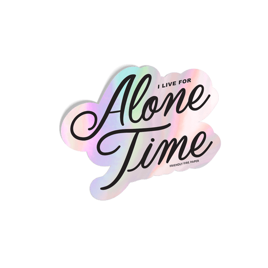 Holographic sticker with 'I Live for Alone Time' in elegant script, featuring an iridescent rainbow effect.