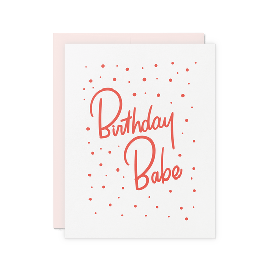 Birthday card with 'Birthday Babe' in bold red hand lettering and confetti details, letterpress printed on thick cotton paper.