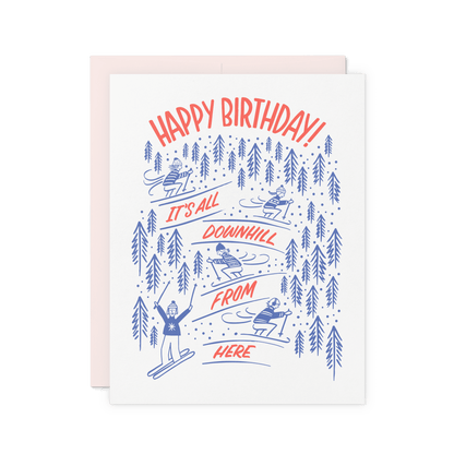 Ski-themed birthday card with 'It’s All Downhill From Here!' and vintage-style skiing illustrations, letterpress printed on thick cotton paper.