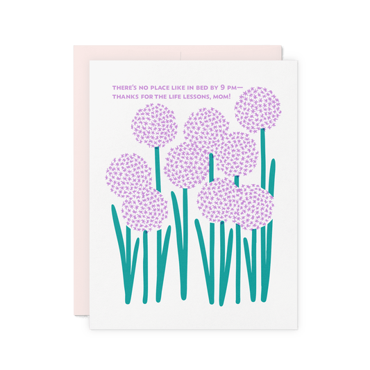 Floral mom card with ‘There’s no place like in bed by 9 PM—thanks for the life lessons, Mom!’ in purple, featuring allium flower illustrations, printed on thick cotton paper.
