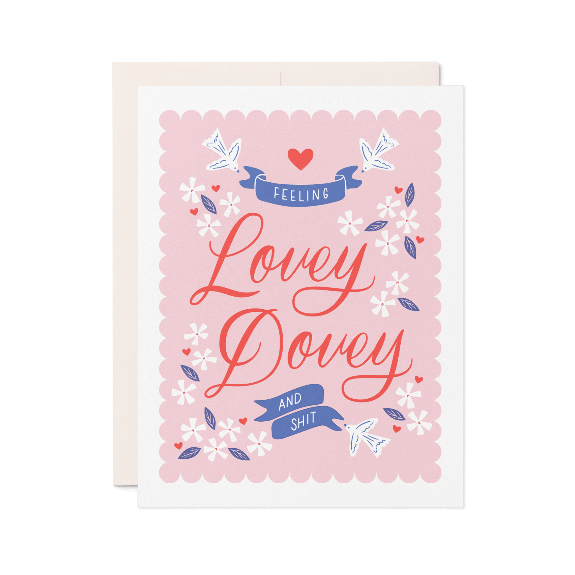 Love card with pink background that reads 'Feeling Lovey Dovey and Shit' in red and blue lettering with floral and bird illustrations.