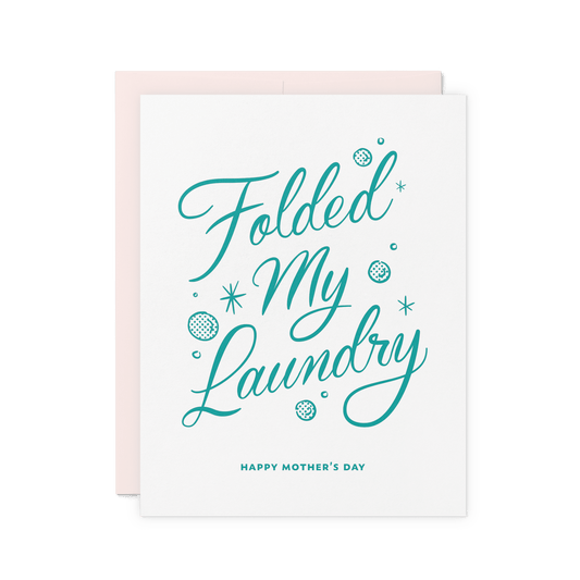 Funny Mother’s Day card with ‘Folded My Laundry’ in teal hand lettering, surrounded by retro-inspired bubble and sparkle details, printed on thick cotton paper.