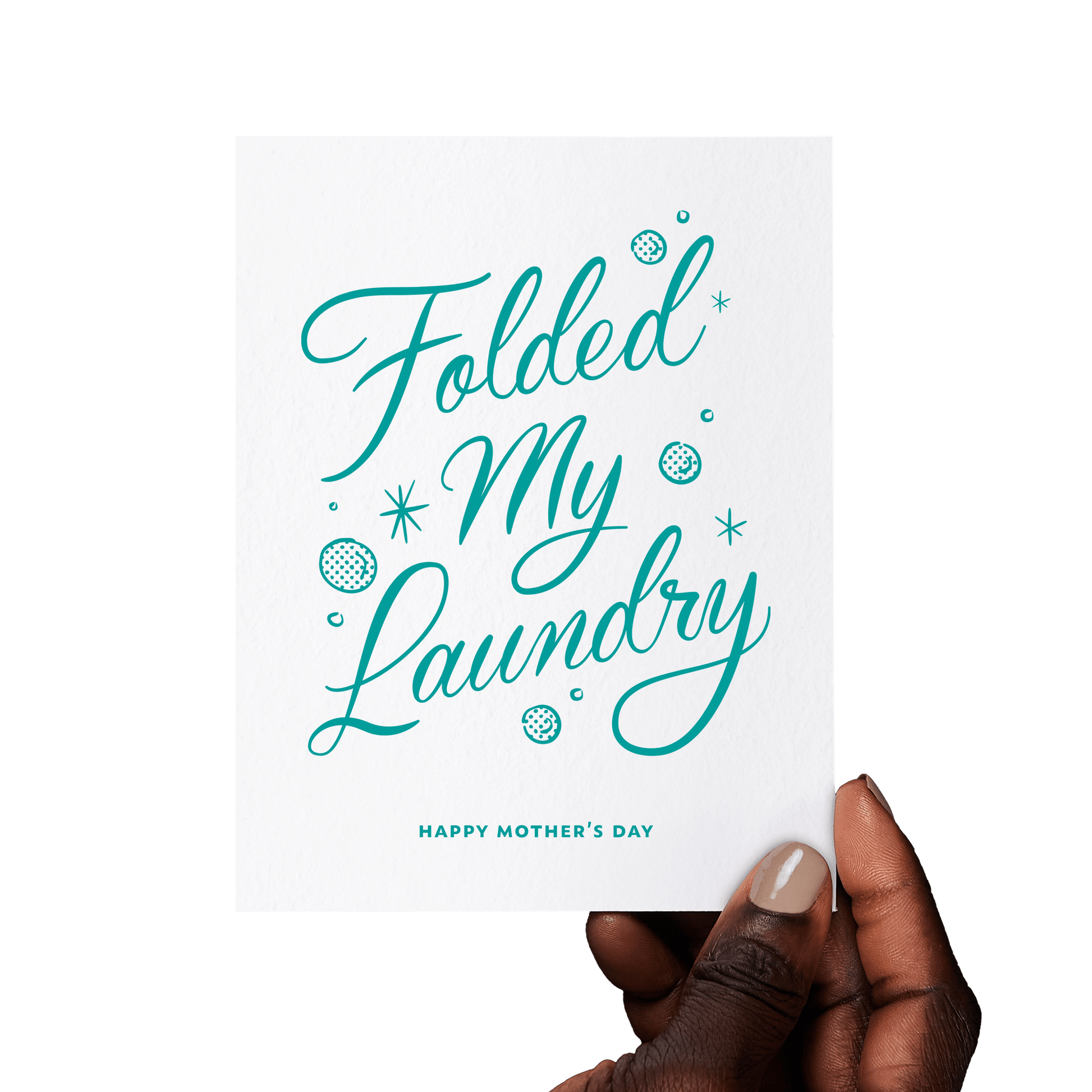 Hand holding a funny Mother’s Day card with ‘Folded My Laundry’ in teal hand lettering, accented with vintage-style bubbles and stars.