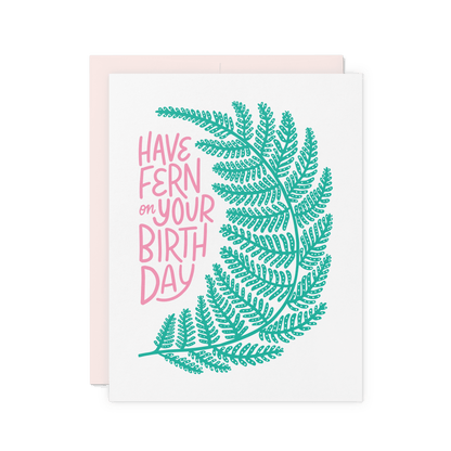 Botanical birthday card with a hand-drawn fern and pink hand-lettered text reading 'Have Fern on Your Birthday'.