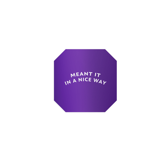 Purple octagon-shaped sticker with ‘Meant It in a Nice Way’ in white lettering, featuring a silky matte mirror finish.