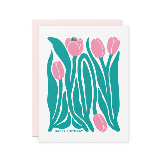 Tulip illustration birthday card with bold pink tulips and green leaves, letterpress printed on cotton paper.